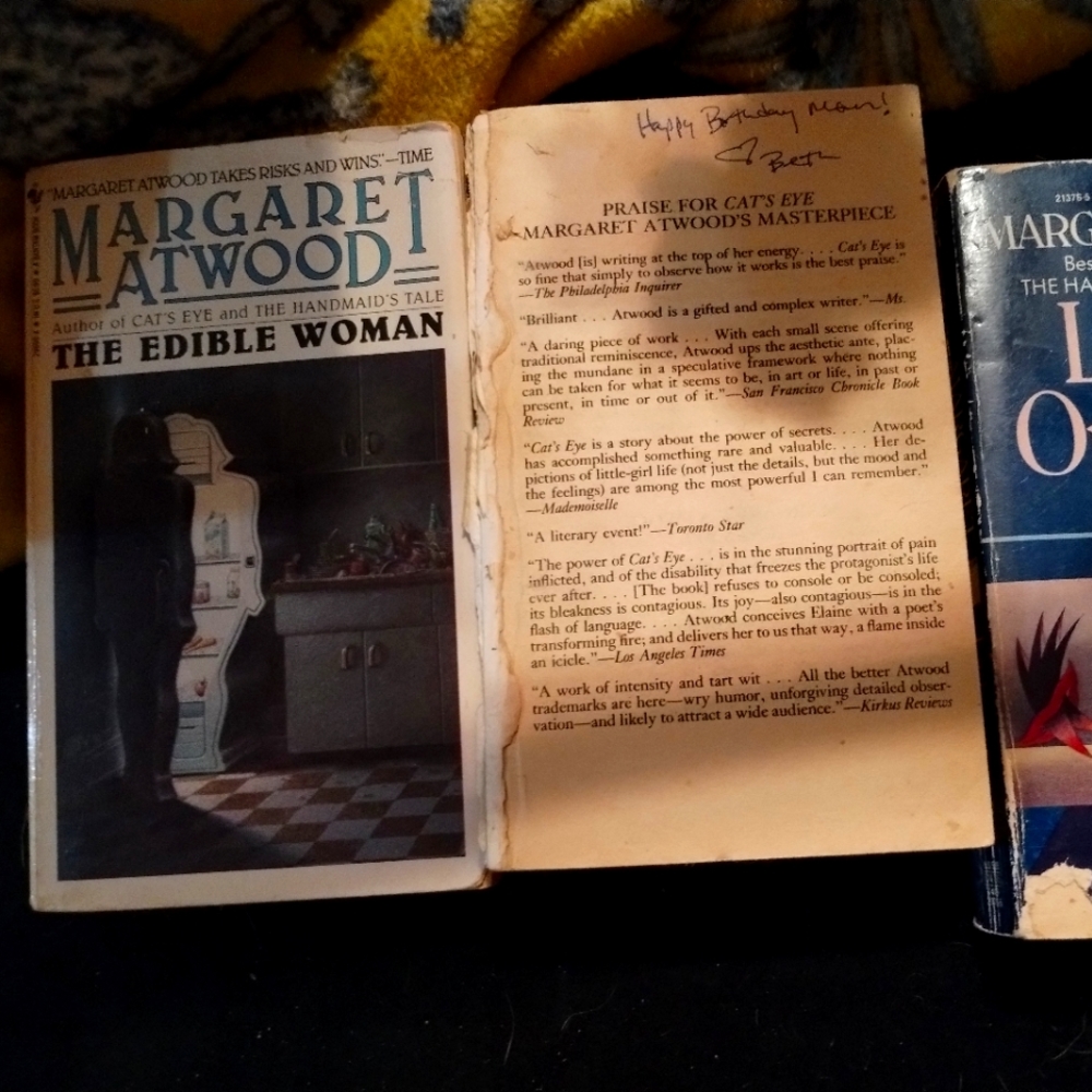 Three Margaret Atwood paperback novels used condition one missing cover